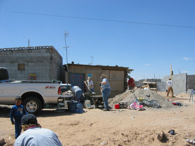 Image 15 of 168
the family's existing residence, next to someone else's cinder block structure