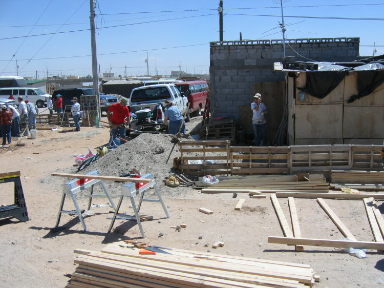 Image 21 of 168
dan and gilia make concrete in a wheel barrow