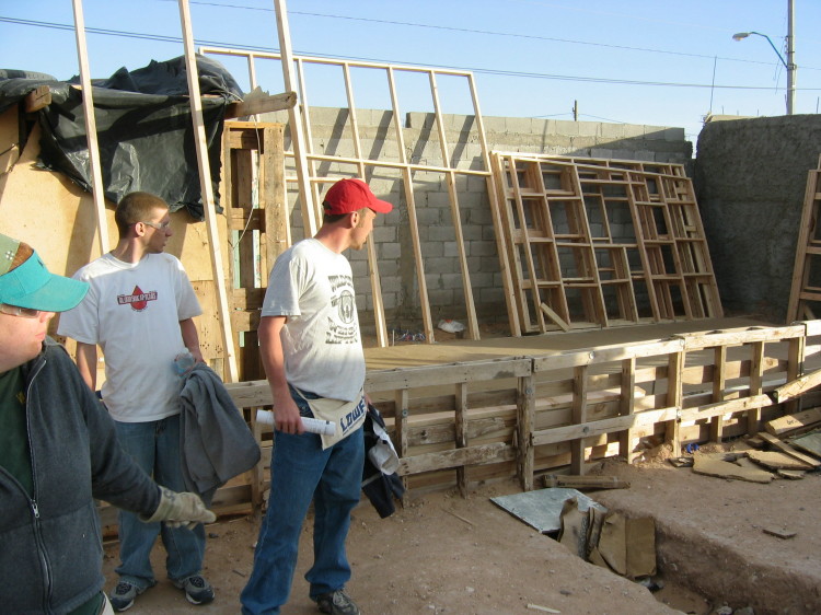 Image 56 of 168
end of day 1.  concrete done, all wall and roof sections framed