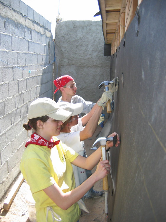 Image 101 of 168
val, jen, and tony hang tar paper